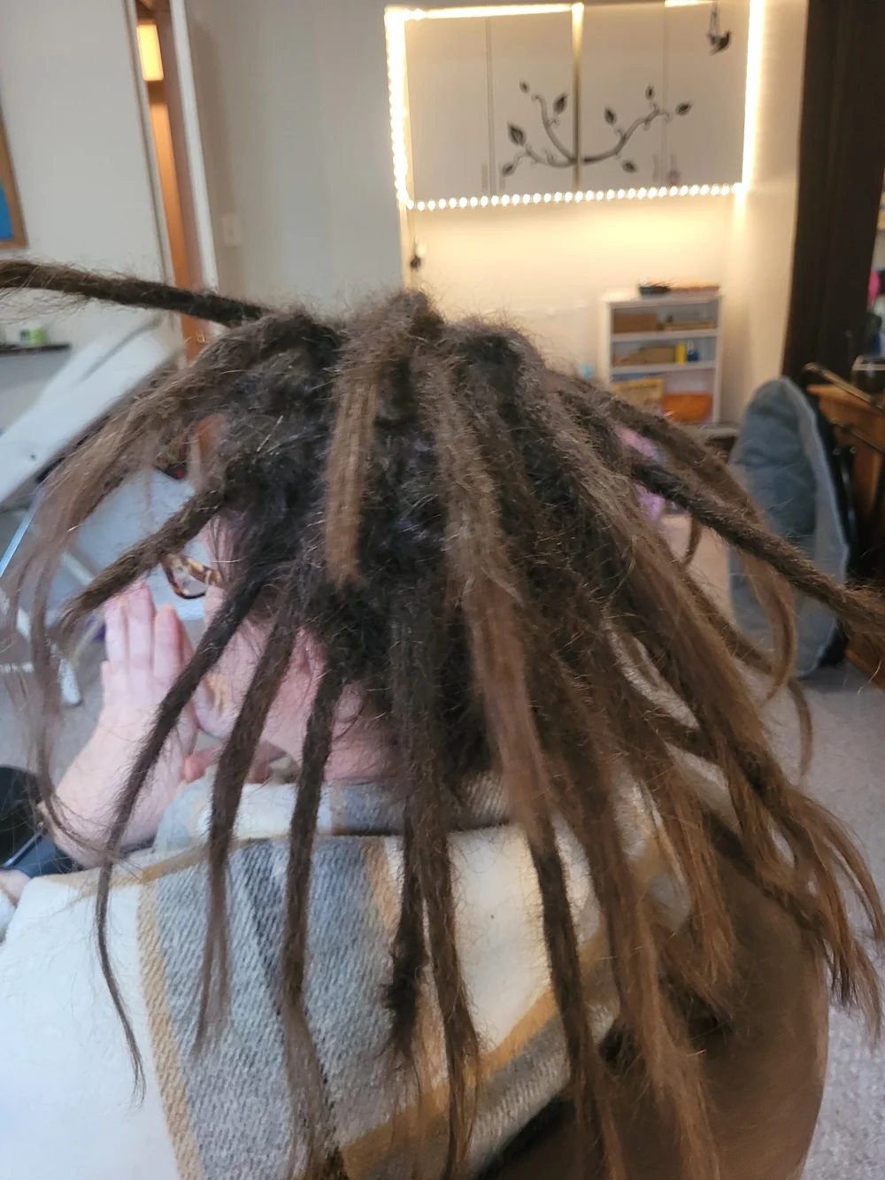 Close view of sectioned dreadlocks during a hair appointment